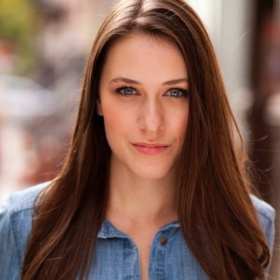 Portrait image of Devin Mccall. She's wearing a denim shirt